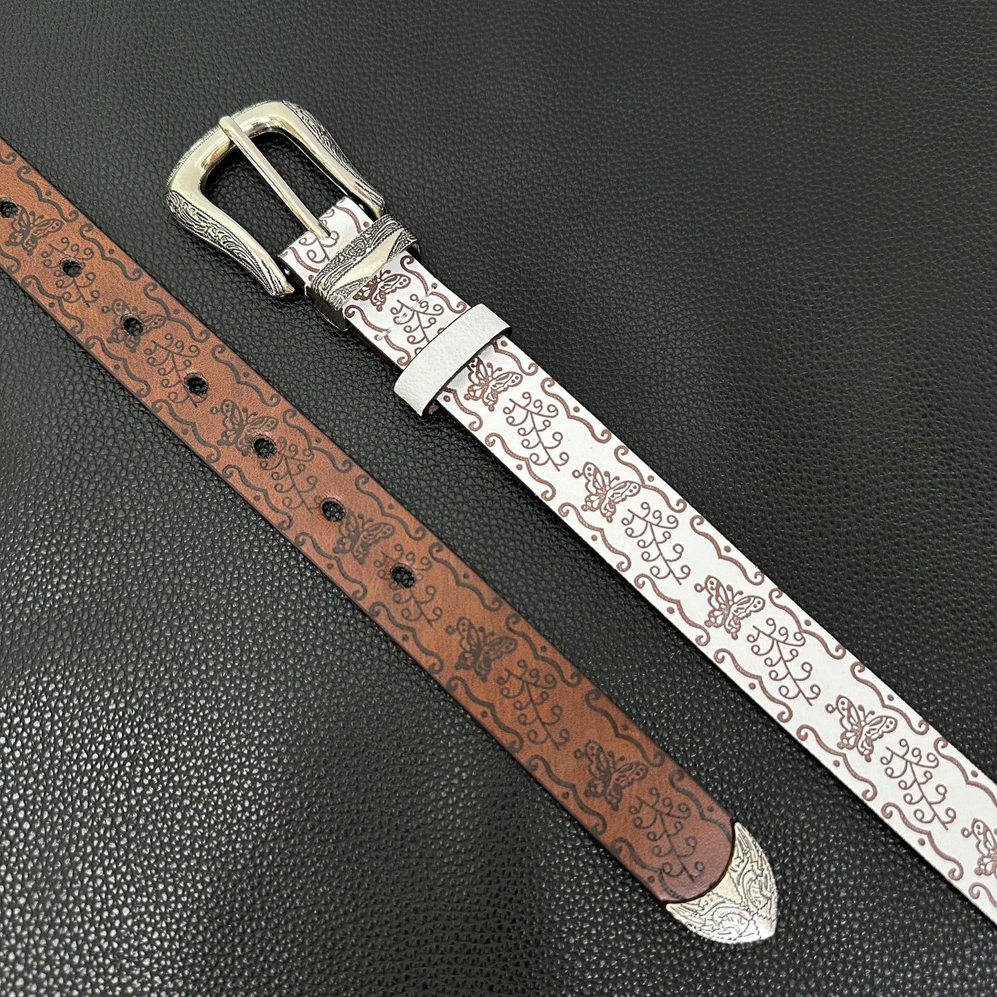 White western belt with brown butterfly embossing and engraved pin buckle
