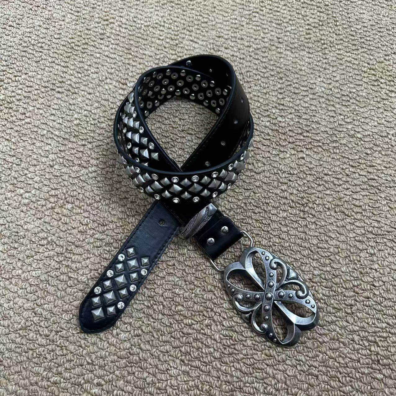 White pyramid-stud punk belt with rhinestones and antique floral buckle