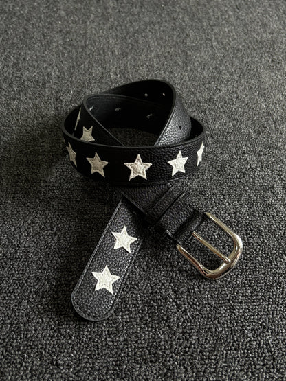 Black pebbled belt with white star inlays and a silver pin buckle