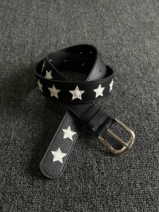 Black pebbled belt with white star inlays and a silver pin buckle