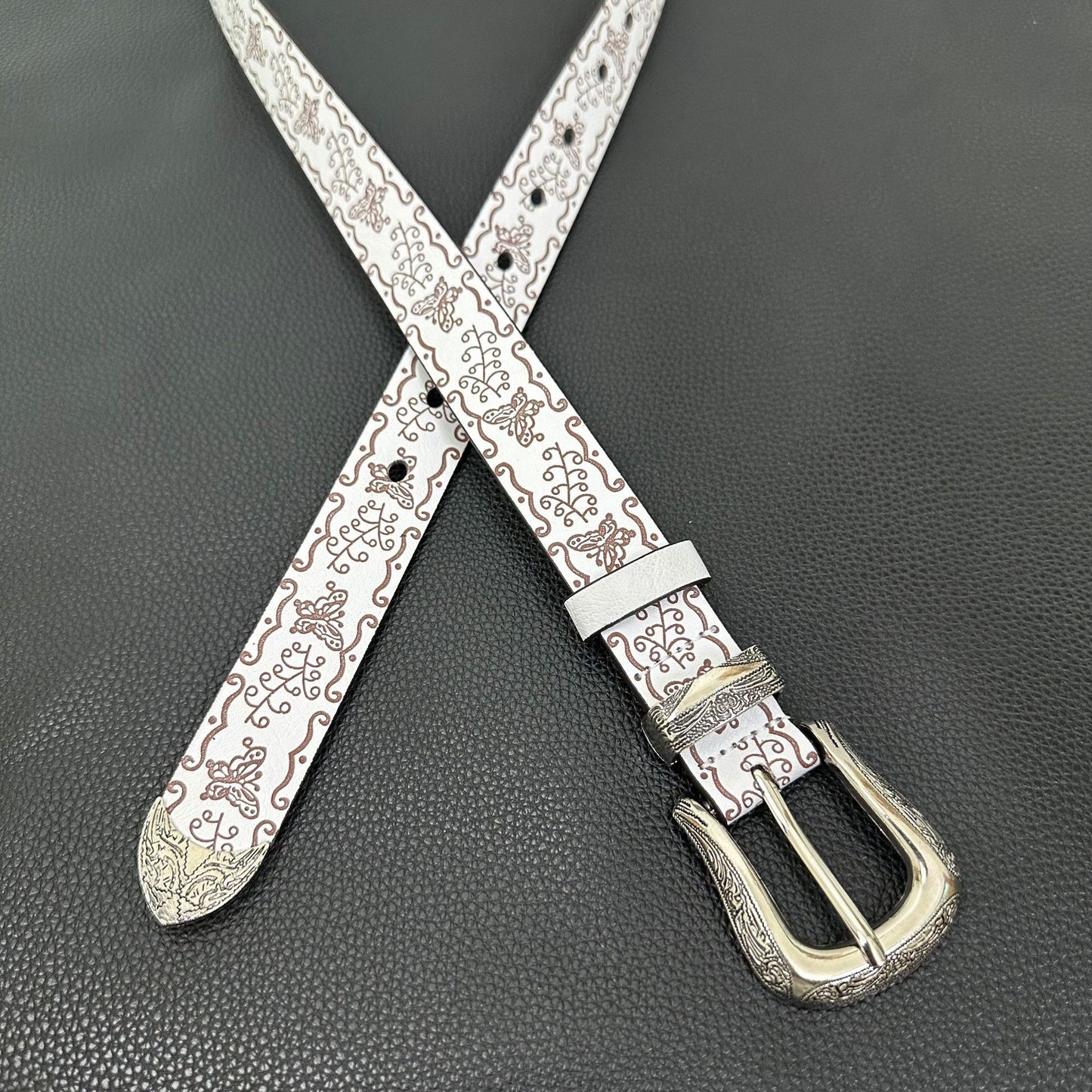 White western belt with brown butterfly embossing and engraved pin buckle