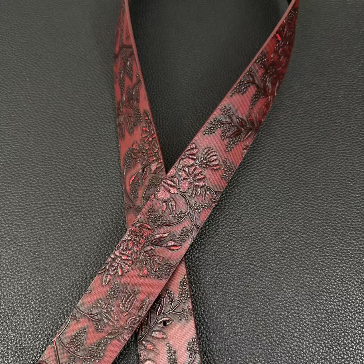 Burgundy rose-embossed western belt with double-horse oval buckle