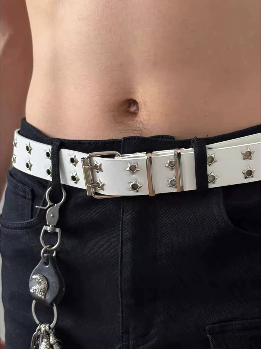 White Y2K belt with star-shaped grommets worn on black pants