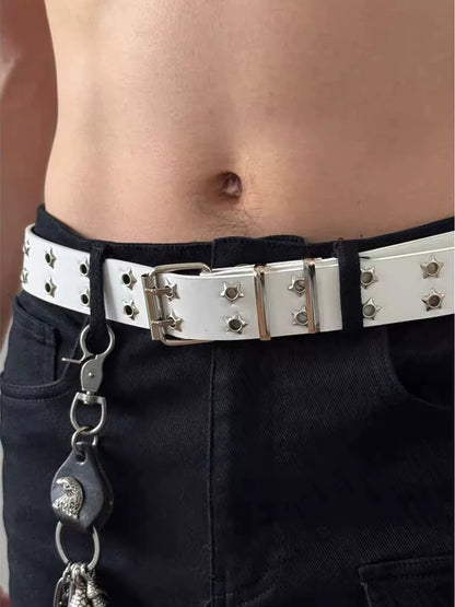 White Y2K belt with star-shaped grommets worn on black pants