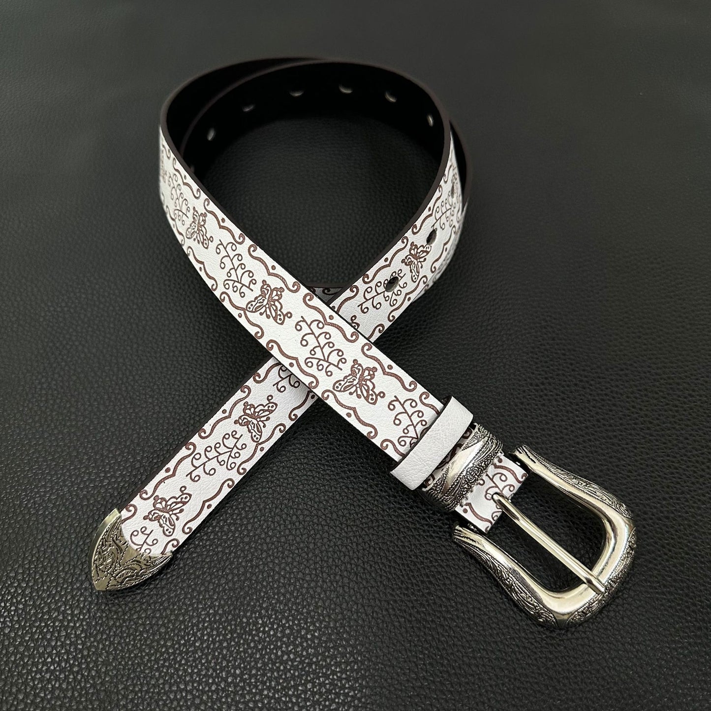 White western belt with brown butterfly embossing and engraved pin buckle