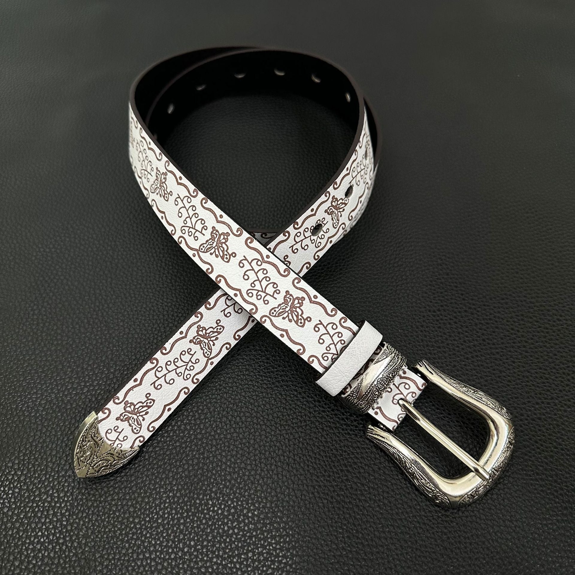 White western belt with brown butterfly embossing and engraved pin buckle