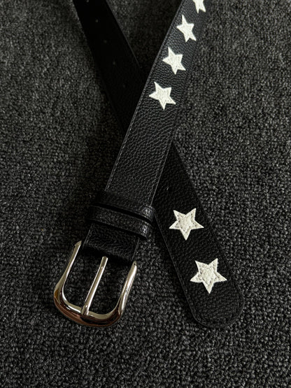 Black pebbled belt with white star inlays and a silver pin buckle
