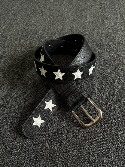 Black pebbled belt with white star inlays and a silver pin buckle