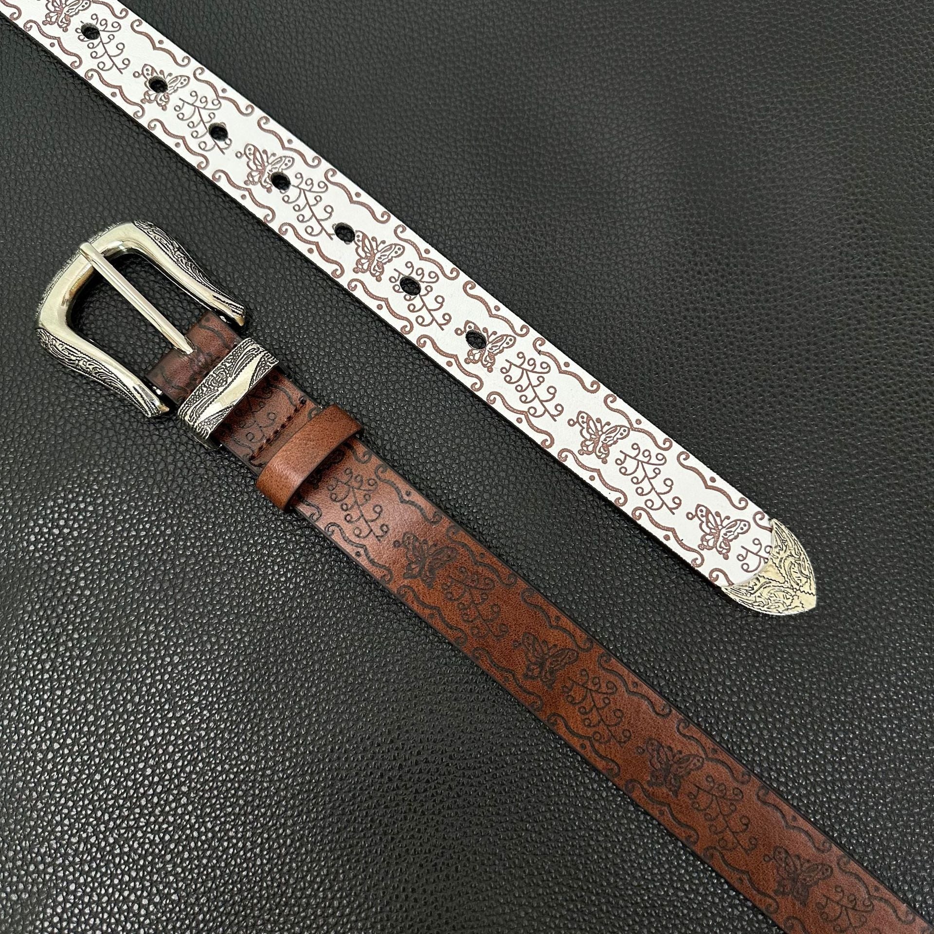White western belt with brown butterfly embossing and engraved pin buckle