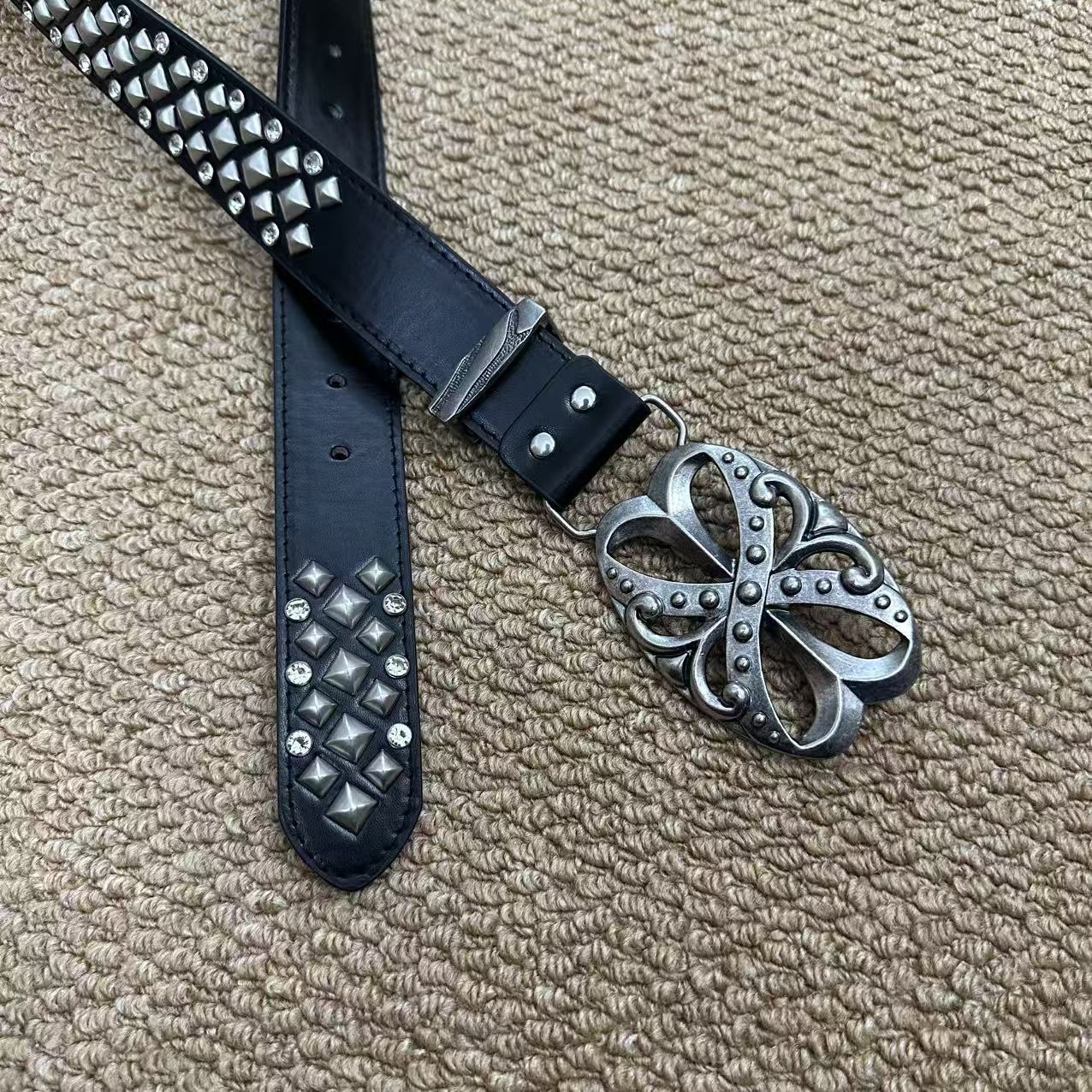 White pyramid-stud punk belt with rhinestones and antique floral buckle