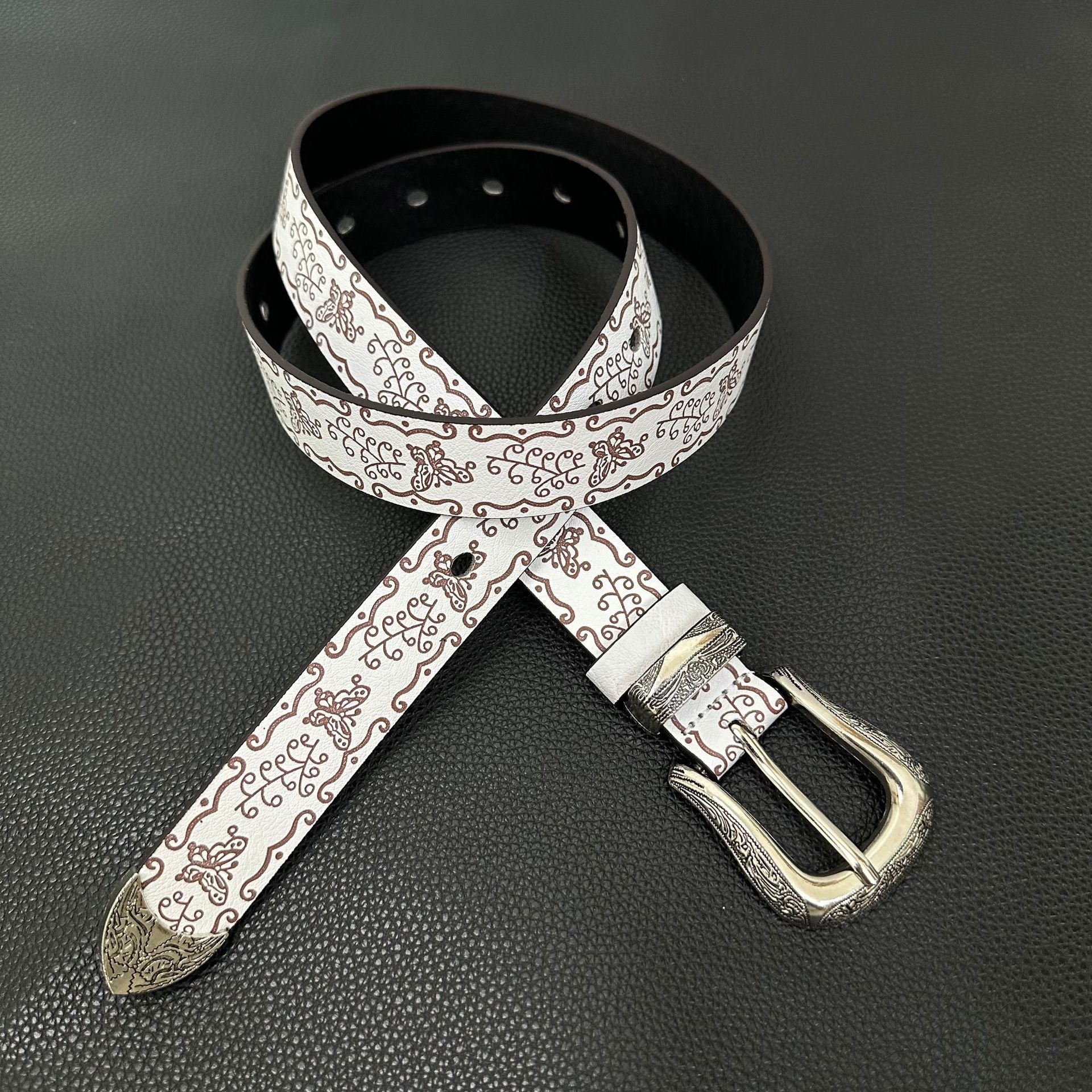 White western belt with brown butterfly embossing and engraved pin buckle